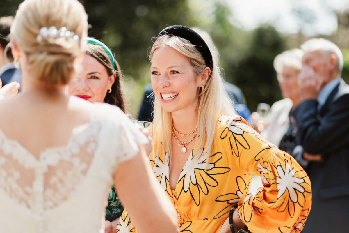 guest smiling at Orleans house gallery wedding Twickenham