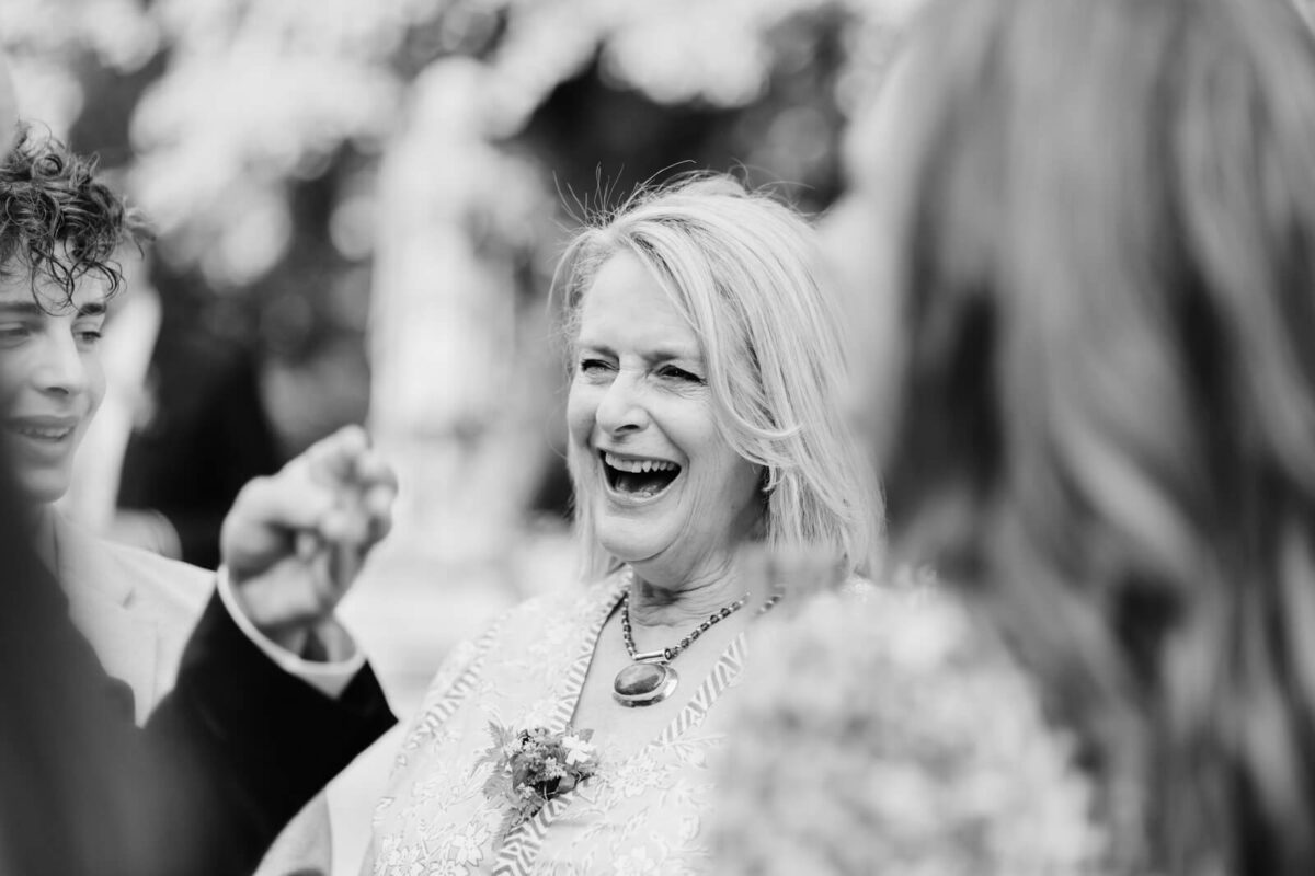 guest smiling at Orleans house gallery wedding Twickenham