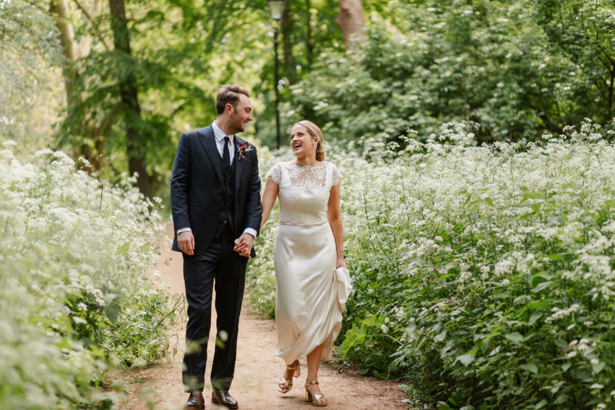 bride and groom smiling at Orleans house gallery wedding Twickenham