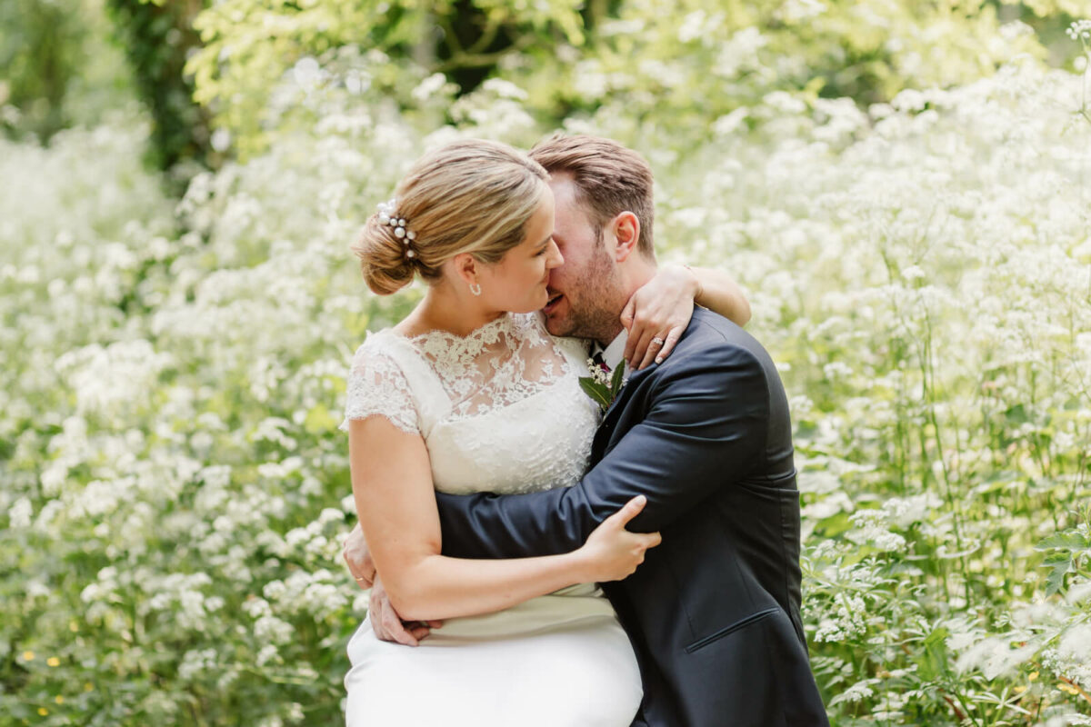 bride and groom hugging at Orleans house gallery wedding Twickenham