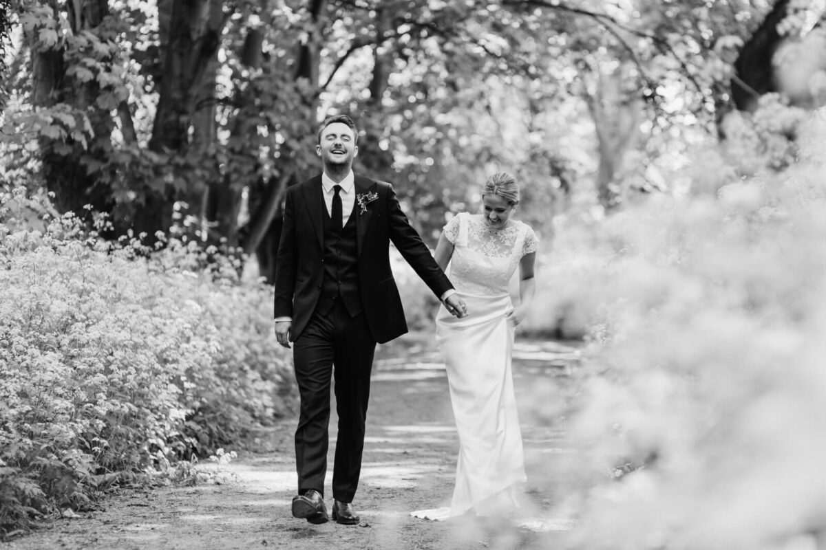 bride and groom laughing at Orleans house gallery wedding Twickenham