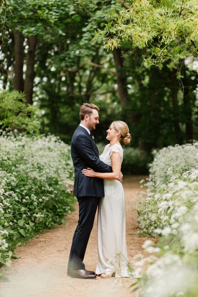 bride and groom laughing at Orleans house gallery wedding Twickenham