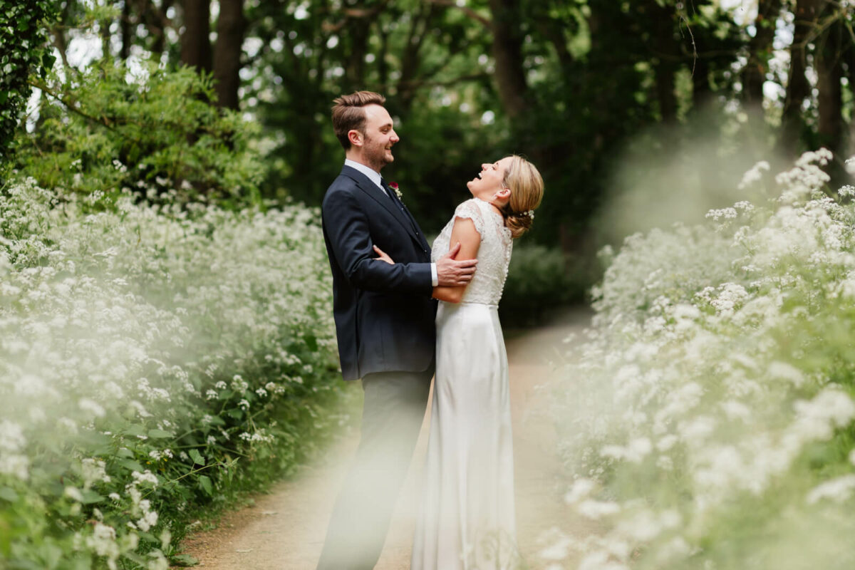 bride and groom laughing at Orleans house gallery wedding Twickenham