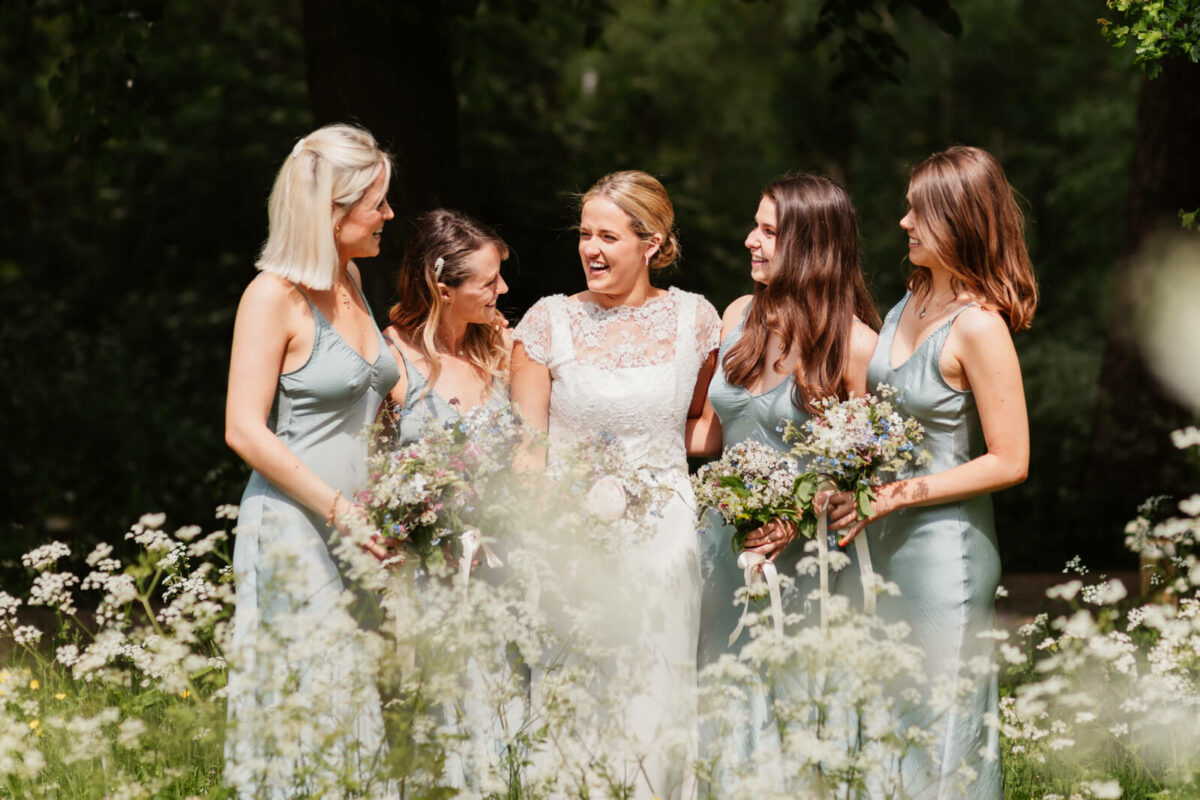 bride and bridesmaids laughing at Orleans house gallery wedding Twickenham