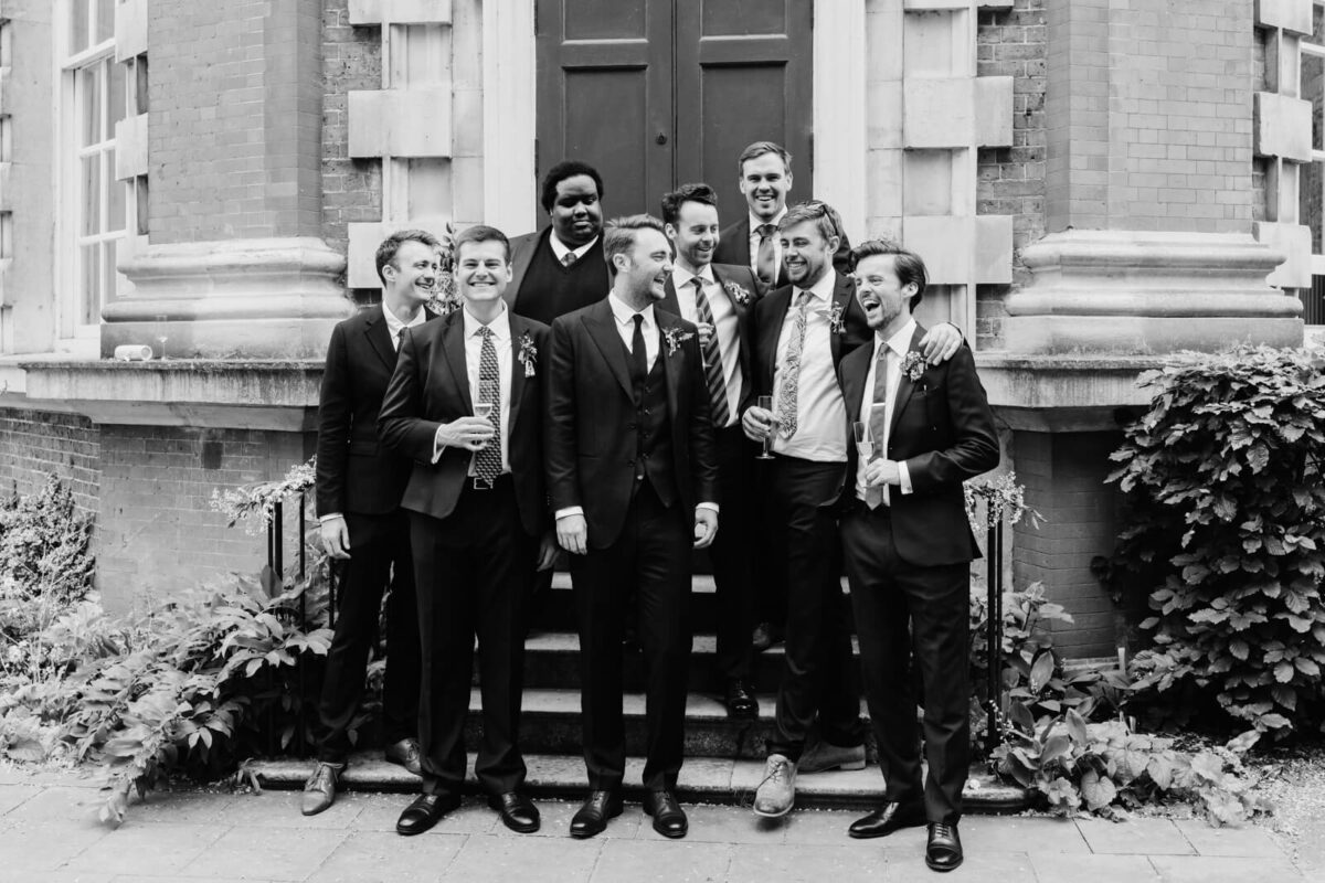 groomsmen laughing at Orleans house gallery wedding Twickenham