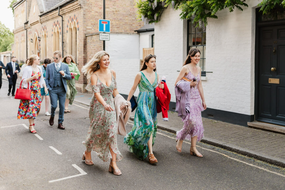 Orleans gallery wedding guests walking along country lane