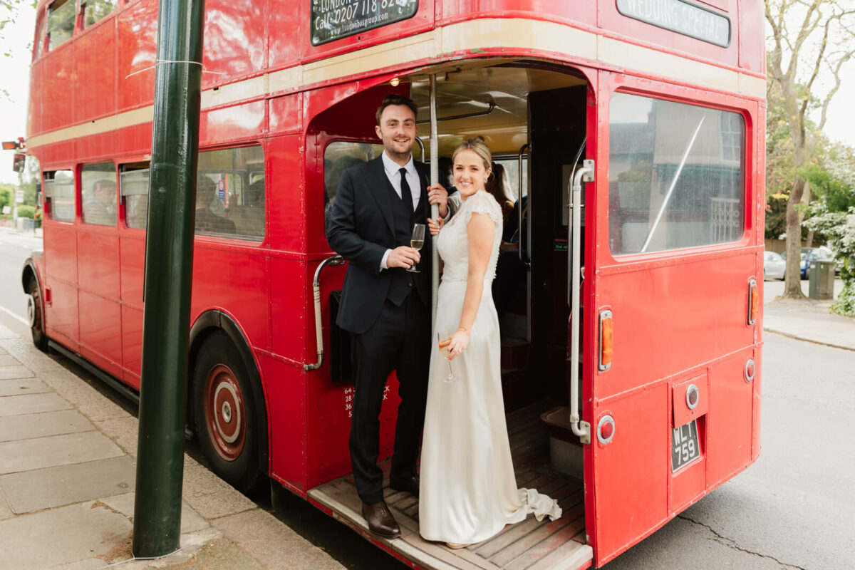 bride and groom on red route master