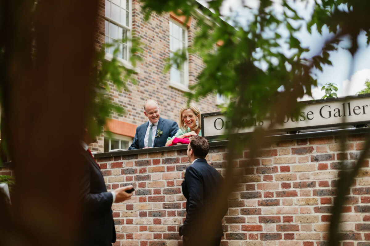 parents of the bride laughing at Orleans house gallery wedding