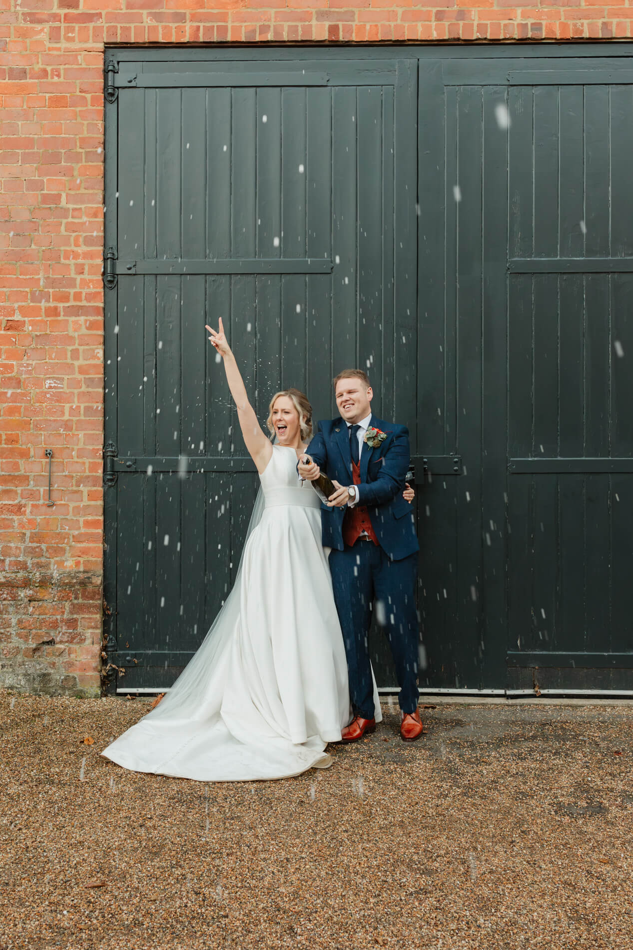 bride and groom in champagne spray