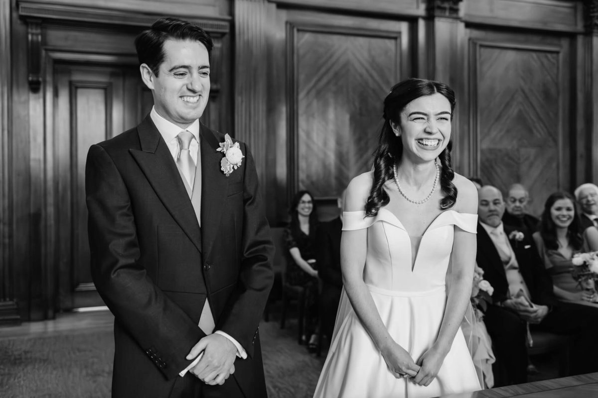 photograph of bride and groom laughing with eachother