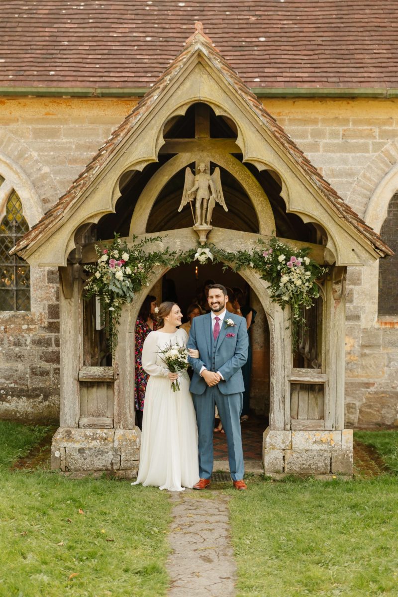 picture of bride and groom leaving horsted church