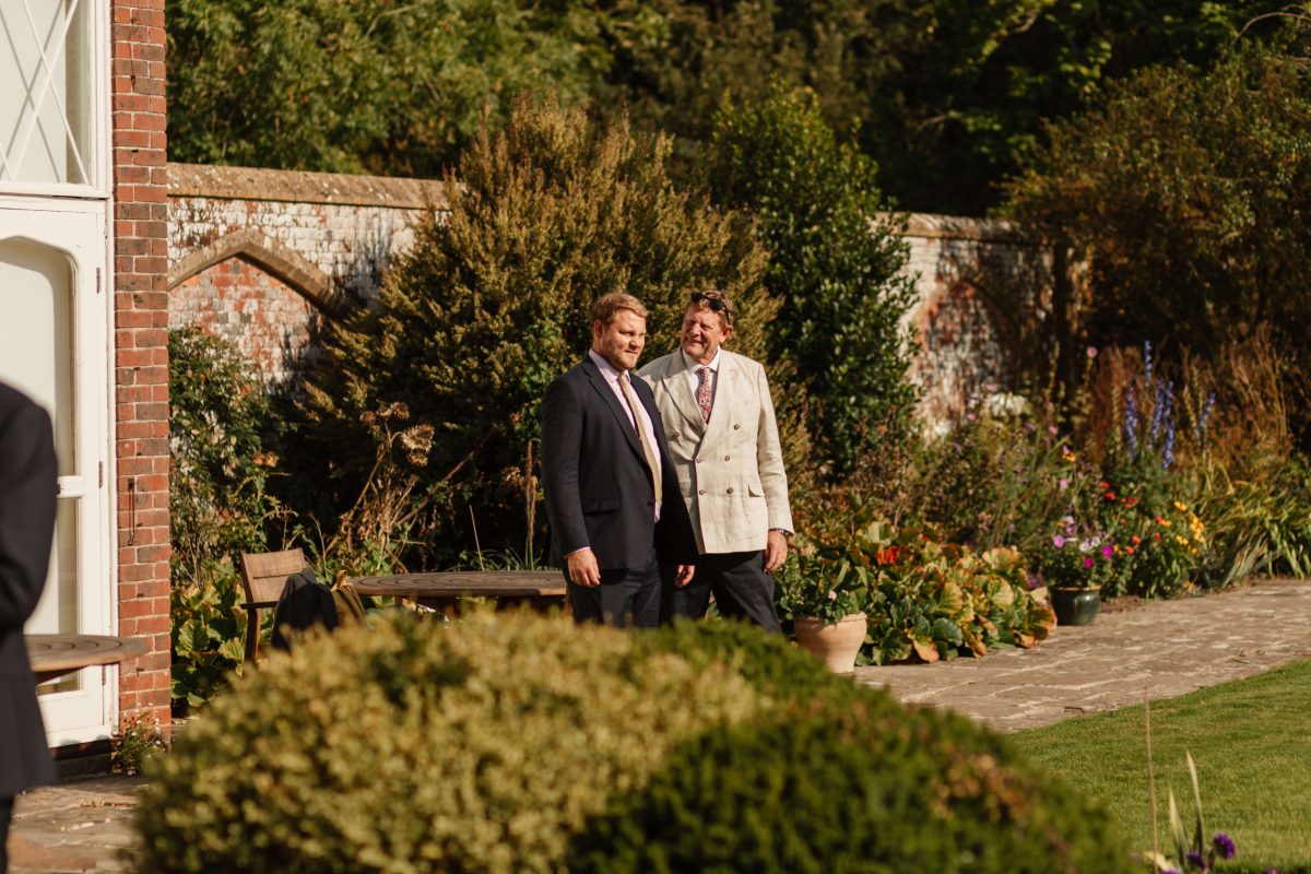 pictures of guests enjoying drinks reception at horsted place hotel