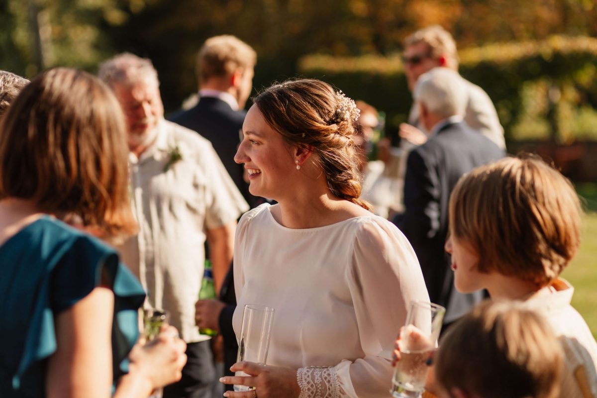 pictures of guests enjoying drinks reception at horsted place hotel