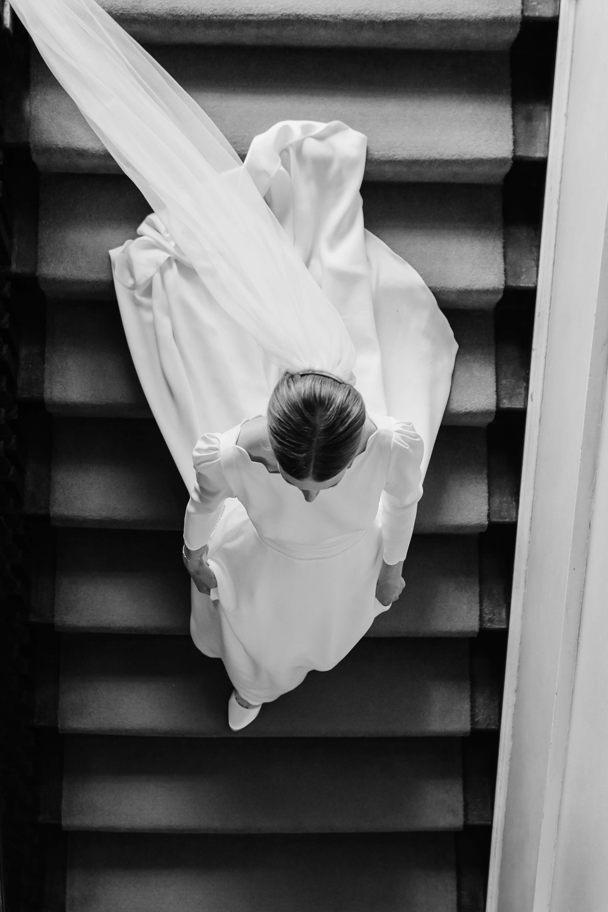 birds eye view of bride walking down the stairs by west midlands wedding photographer
